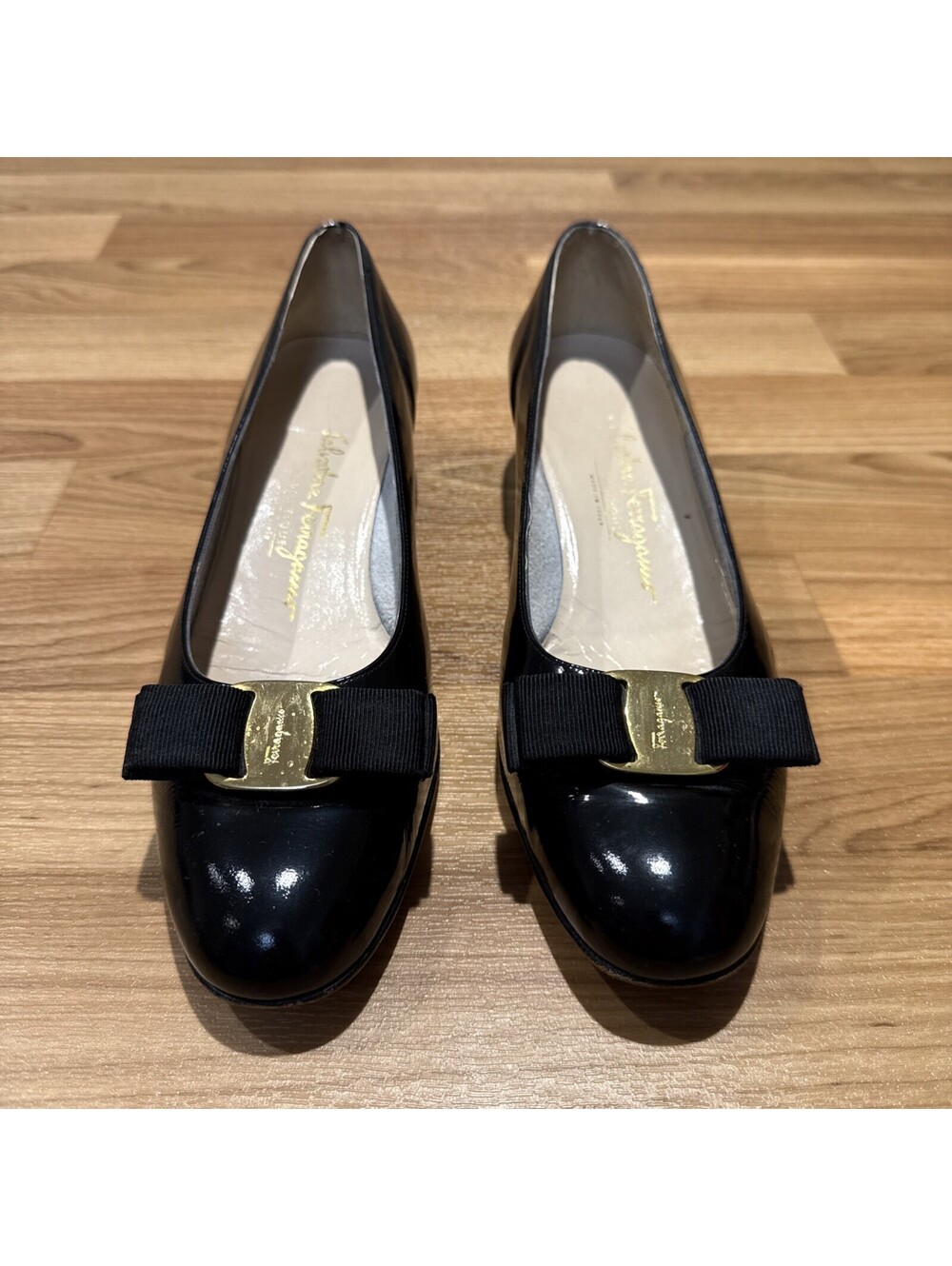 Ferragamo "Vara" black patent pumps with bow, size 9-1/2B. Made in Italy.
